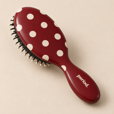 Mini burgundy polka-dot hairbrush